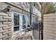 View of the quaint patio with double glass doors leading into the residence at 6940 Roswell Rd # 5B, Atlanta, GA 30328