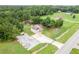 The spacious property includes a home, guest house, and private drive, all enveloped by verdant trees and open fields at 1585 Elliott Rd, Mcdonough, GA 30252