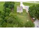 Expansive lawn and wooded area surround this lovely two-story home with a large driveway and fenced perimeter at 1585 Elliott Rd, Mcdonough, GA 30252