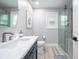 Elegant bathroom featuring shaker vanity, glass shower and sleek finishes at 1585 Elliott Rd, Mcdonough, GA 30252