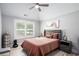 Comfortable bedroom with tray ceiling, window and earth-tone accents for a cozy and relaxing atmosphere at 1585 Elliott Rd, Mcdonough, GA 30252