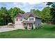 Charming two-story home with brick and siding, a well-manicured lawn, and mature trees at 1585 Elliott Rd, Mcdonough, GA 30252