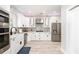 Modern kitchen featuring white cabinets, stainless steel appliances, and granite countertops at 1585 Elliott Rd, Mcdonough, GA 30252