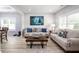 Comfortable living room with neutral color scheme, plank flooring, and bright natural light at 1585 Elliott Rd, Mcdonough, GA 30252