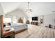 Large main bedroom featuring a vaulted ceiling, wood floors, and lots of natural light at 1585 Elliott Rd, Mcdonough, GA 30252