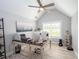 Home office space with vaulted ceiling, neutral walls, shuttered windows and a desk at 1585 Elliott Rd, Mcdonough, GA 30252