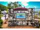 Stone entrance sign with manicured landscaping and community name: The Glens at 206 Glens Loop, Woodstock, GA 30188