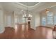 Spacious living room featuring hardwood floors, neutral walls, and open floor plan at 206 Glens Loop, Woodstock, GA 30188