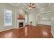 Bright living room featuring a fireplace, coffered ceiling, hardwood floors, and neutral walls at 206 Glens Loop, Woodstock, GA 30188