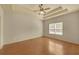 Spacious main bedroom featuring hardwood floors, tray ceiling, and bright natural light at 206 Glens Loop, Woodstock, GA 30188