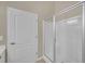Bathroom featuring glass-enclosed shower with white tile surround at 206 Glens Loop, Woodstock, GA 30188