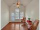 Inviting seating area featuring hardwood floors, floral chairs, and large windows at 206 Glens Loop, Woodstock, GA 30188
