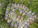 An aerial view of a suburban neighborhood with houses surrounded by trees at 2462 Chestnut Lndg, Atlanta, GA 30360