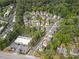 An aerial view of a neighborhood surrounded by lush green trees at 2462 Chestnut Lndg, Atlanta, GA 30360