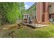 Beautiful backyard with a patio, outdoor grill, and lush greenery at 2462 Chestnut Lndg, Atlanta, GA 30360
