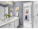 Elegant bathroom with double vanity and mirror, featuring a separate area, enhancing privacy and functionality at 2462 Chestnut Lndg, Atlanta, GA 30360
