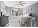 Calming bedroom with neutral tones, ceiling fan, and ample natural light, with crib and matching furniture at 2462 Chestnut Lndg, Atlanta, GA 30360