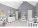 Spacious bedroom with vaulted ceilings, featuring a crib, dresser and ample storage for Bedroom essentials at 2462 Chestnut Lndg, Atlanta, GA 30360