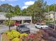 A modern commercial building with colorful landscaping in front at 2462 Chestnut Lndg, Atlanta, GA 30360