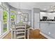 Charming dining area with natural light and modern decor, adjacent to the kitchen at 2462 Chestnut Lndg, Atlanta, GA 30360