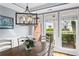 Sunlit dining area with large windows and modern light fixture at 2462 Chestnut Lndg, Atlanta, GA 30360