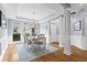 Bright dining room with picture frame molding and contemporary lighting fixture at 2462 Chestnut Lndg, Atlanta, GA 30360
