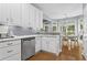 Well-lit kitchen with modern appliances and a view of the adjacent dining area at 2462 Chestnut Lndg, Atlanta, GA 30360