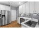 Contemporary kitchen with stainless steel appliances, sleek countertops, and ample storage space at 2462 Chestnut Lndg, Atlanta, GA 30360