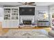Bright living room boasts built-in shelving, a cozy fireplace, and ample natural light at 2462 Chestnut Lndg, Atlanta, GA 30360