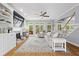 Bright living room with hardwood floors, fireplace, and large windows overlooking the deck at 2462 Chestnut Lndg, Atlanta, GA 30360