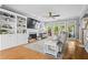 Cozy living room featuring built-in bookshelves, fireplace, and hardwood flooring at 2462 Chestnut Lndg, Atlanta, GA 30360