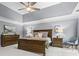 Spacious main bedroom features a tray ceiling and ample natural light at 2462 Chestnut Lndg, Atlanta, GA 30360