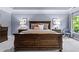 Comfortable main bedroom with neutral walls, carpet, and king bed at 2462 Chestnut Lndg, Atlanta, GA 30360
