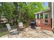Charming stone patio with grill and seating for outdoor relaxation and entertaining at 2462 Chestnut Lndg, Atlanta, GA 30360