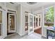 Sunroom showcasing access to deck with plentiful natural light and neutral colors at 2462 Chestnut Lndg, Atlanta, GA 30360