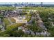 Aerial view of the property showcasing its location within a leafy neighborhood with city views at 1079 Arbor Ne Trce, Atlanta, GA 30319