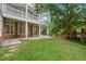 Expansive backyard featuring a brick patio, lush lawn, and access to the upper level balconies at 1079 Arbor Ne Trce, Atlanta, GA 30319