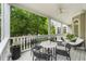 Inviting balcony with a ceiling fan and a seating area with lovely views of the yard at 1079 Arbor Ne Trce, Atlanta, GA 30319