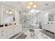 Luxurious bathroom with marble flooring, a glass-enclosed shower, and dual vanities offering a spa-like experience at 1079 Arbor Ne Trce, Atlanta, GA 30319