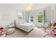 Light-filled bedroom with neutral tones, arched windows, and cozy decor at 1079 Arbor Ne Trce, Atlanta, GA 30319