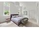 Sunlit bedroom featuring a comfortable bed, large windows, and stylish decor at 1079 Arbor Ne Trce, Atlanta, GA 30319