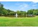 Scenic view of the community pond with a fountain and lush greenery, creating a serene atmosphere at 1079 Arbor Ne Trce, Atlanta, GA 30319