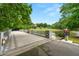 Picturesque view of the community bridge and pond surrounded by lush green trees and landscaping at 1079 Arbor Ne Trce, Atlanta, GA 30319