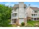 View of the home with multiple balconies, brick foundation and side yard at 1079 Arbor Ne Trce, Atlanta, GA 30319