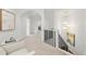 Upstairs hallway with white walls, black metal railing, carpet flooring and striking modern light fixture at 1079 Arbor Ne Trce, Atlanta, GA 30319