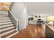 Inviting hallway with hardwood floors and stairs, leading to an open-concept living space at 1079 Arbor Ne Trce, Atlanta, GA 30319