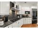 Stylish kitchen with modern appliances, sleek countertops, stainless steel hood vent, and white cabinetry at 1079 Arbor Ne Trce, Atlanta, GA 30319