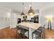 Modern kitchen featuring a large island, marble countertops, stainless steel appliances, and pendant lighting at 1079 Arbor Ne Trce, Atlanta, GA 30319