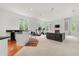 Open living space with a bar, exercise equipment, and fireplace with built-in shelving at 1079 Arbor Ne Trce, Atlanta, GA 30319
