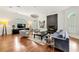 Inviting living room featuring hardwood floors, modern decor, a fireplace, and ample natural light at 1079 Arbor Ne Trce, Atlanta, GA 30319